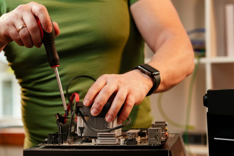 Close up of man repairing computer system unit Close up of man repairing computer system unit