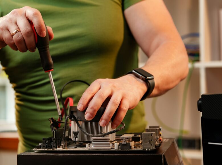 Close up of man repairing computer system unit Close up of man repairing computer system unit