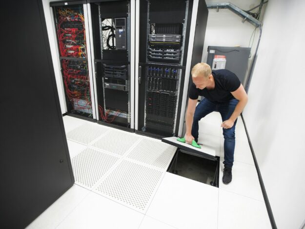 Computer Engineer Lifting Floor Tile Using Suction Cups In Datac Computer Engineer Lifting Floor Tile Using Suction Cups In Datac